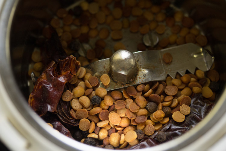 roasted spices added to a grinder jar. 