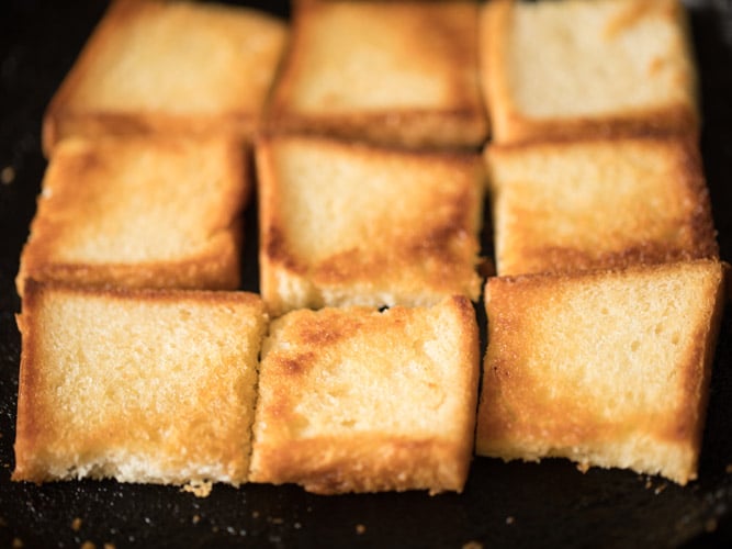 toasting bread pieces till golden from both sides for making double ka meetha recipe. 