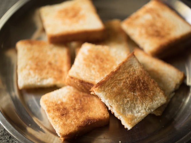 toasted bread pieces kept on a plate. 