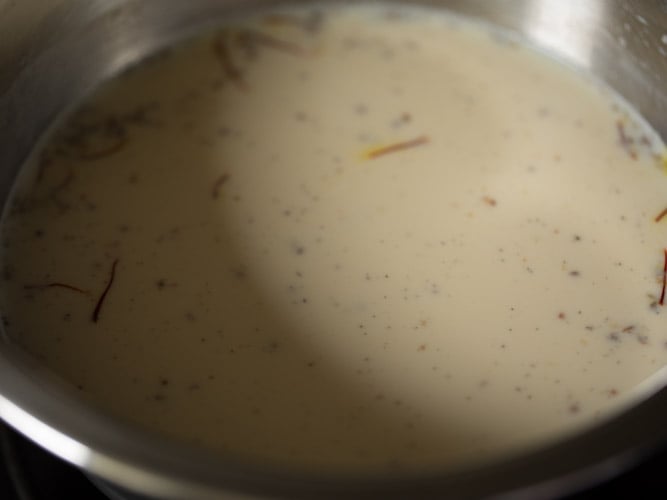 warm condensed milk mixture for making double ka meetha recipe. 