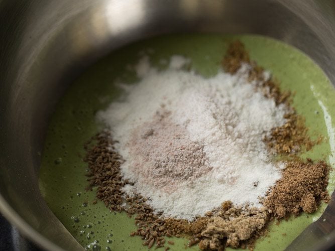 black salt and regular salt added to bowl. 