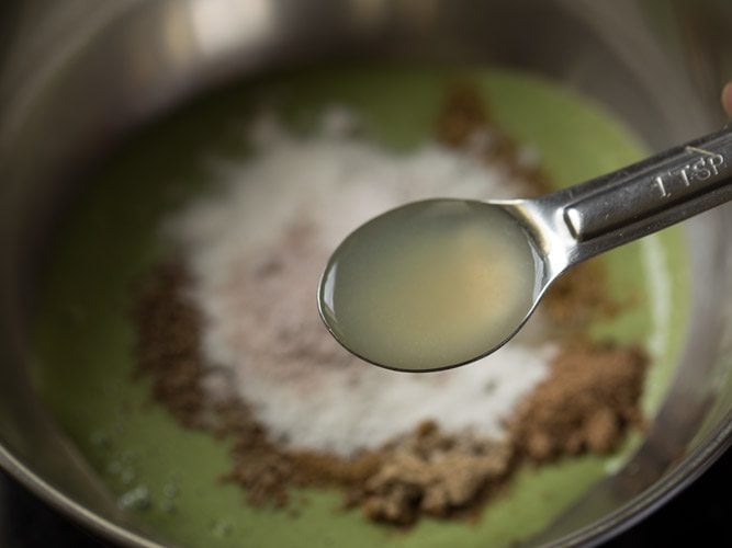 adding lemon juice to the bowl. 