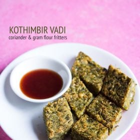 kothimbir vadi served in a white plate with sauce in a small bowl