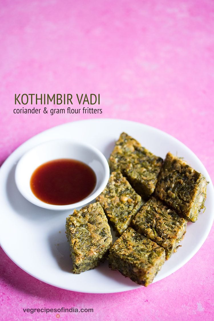 kothimbir vadi served on a white plate with sauce in a small bowl and text layover.