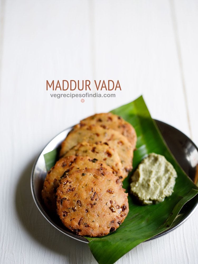 maddur vada placed on a banana leaf kept on a serving plate with a side of coconut chutney and text layovers.