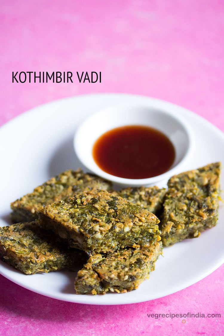 kothimbir vadi served in a white plate with sauce in a small bowl