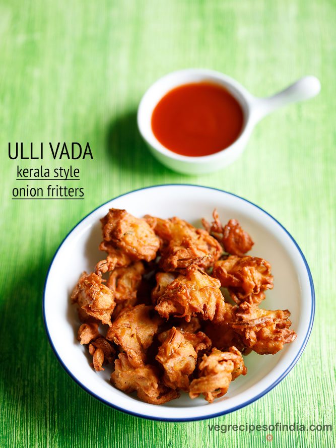 ulli vada served in a blue rimmed white plate with a small bowl of tomato ketchup kept on the top right side and text layovers.