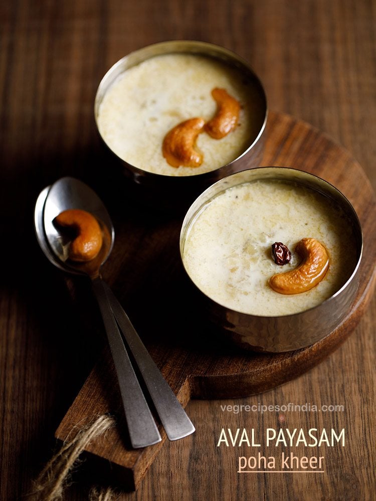 The aval payasam is garnished with fried cashews and raisins and served in 2 bowls with fried cashews on a spoon on the left and left to serve halfway.