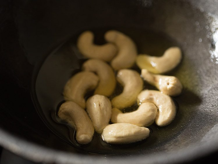 Fry cashew nuts on low flame to make poha kheer. 