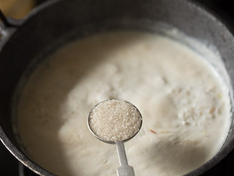 Add sugar to the boiling payasam. 