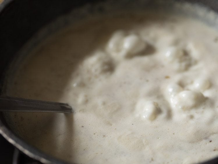 mixing ingredients well into the payasam.