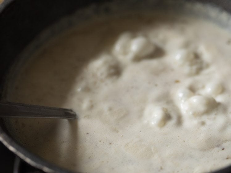 mixing ingredients well into the payasam. 