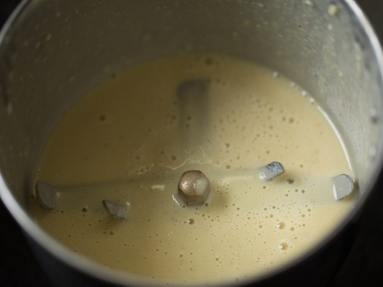 almonds, sugar, spices, and milk after grinding in the grinder jar.