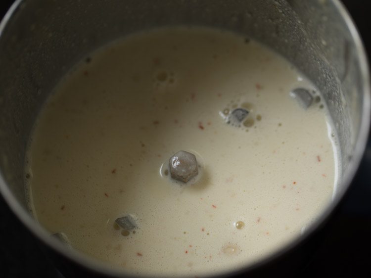 adding more milk to the empty grinder jar to get the last bits of flavor out.