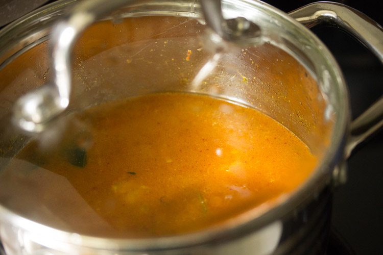 cooking salan in covered pan. 