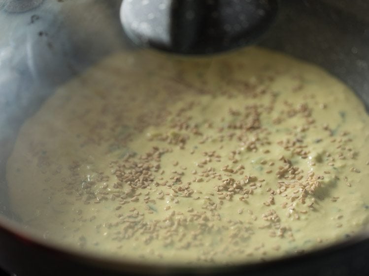 making Gujarati handvo recipe in pan