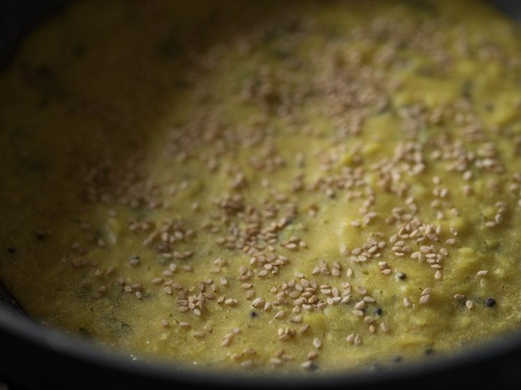 making Gujarati handvo recipe in pan