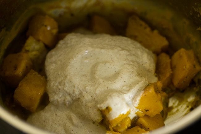 coconut paste added to cooked veggies. 