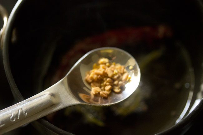 adding slightly crushed fenugreek seeds in the hot oil. 