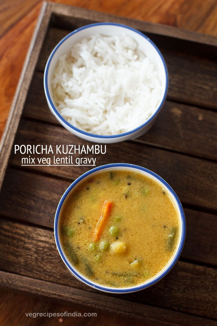 poricha kulambu served in a blue rimmed bowl with a bowl of steamed rice kept on the top side and text layovers.