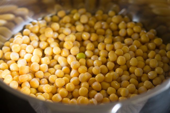 soaked dried white peas added in a pressure cooker. 