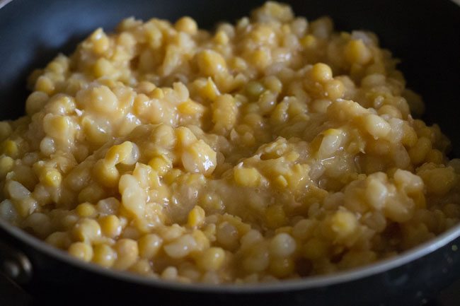 cooked white peas added in a pan and kept on low heat. 