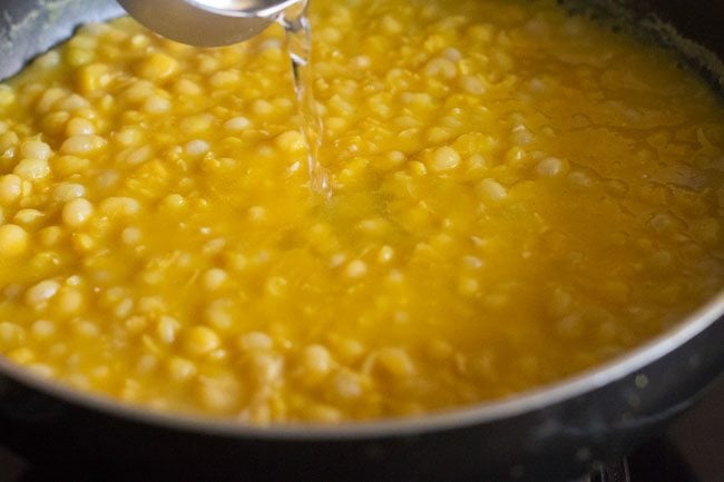 pouring water in the pan. 