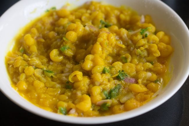 coriander leaves and other ingredients mixed well in the ragda. 