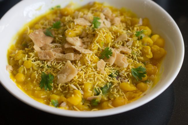 ragda chaat topped with sev and crushed papdis. 
