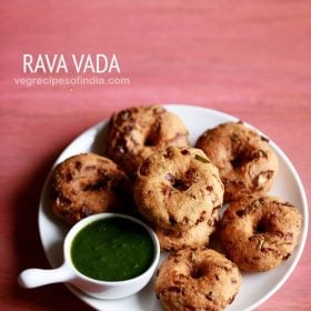 rava vada served on a white plate with a small bowl of green chutney kept on the left side and text layovers.