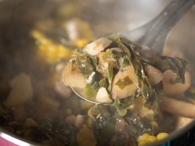 cooking rushichi bhaji.