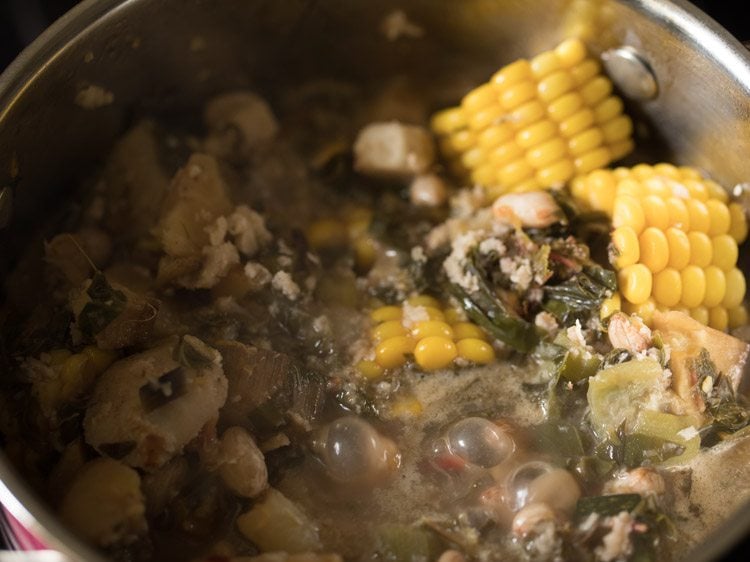 cooking rushichi bhaji. 