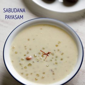 The javvarisi payasam comes in a white bowl with a blue rim and a saffron thread in the center.