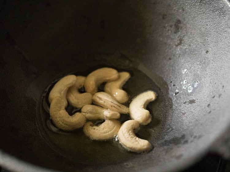 cashews added in melted ghee. 