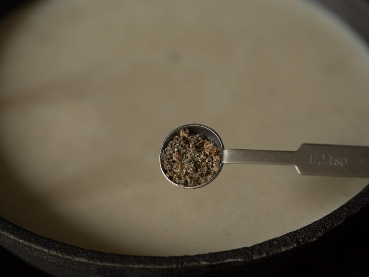 cardamom powder being added. 