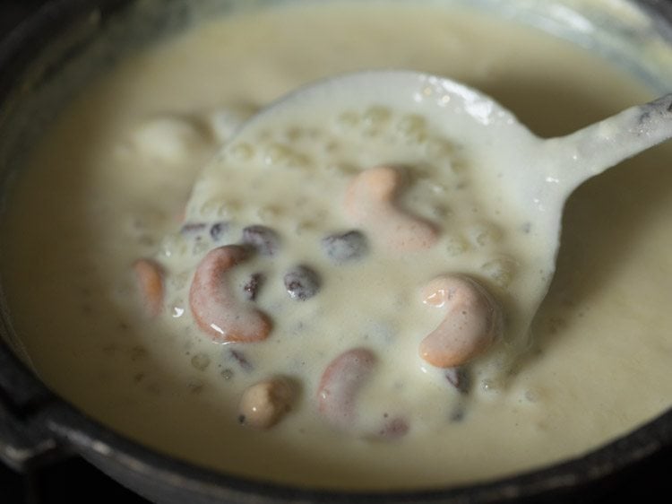 fried cashews and raisins added and mixed with slotted spoon.