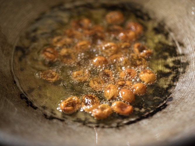 frying raisins in ghee for making vermicelli payasam.
