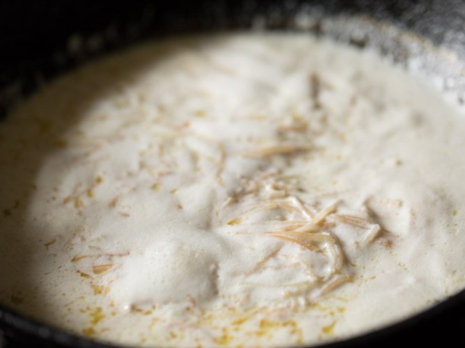 milk simmering, frothing and boiling