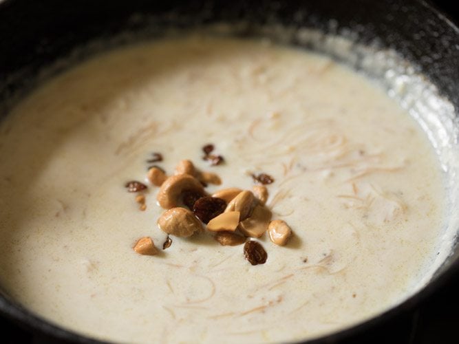 fried cashews and raisins on top of the vermicelli pudding