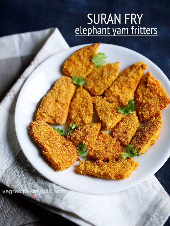 yam fries arranged on a white plate and garnished with coriander leaves placed on a grey and white napkin on a dark blue board with a text layover