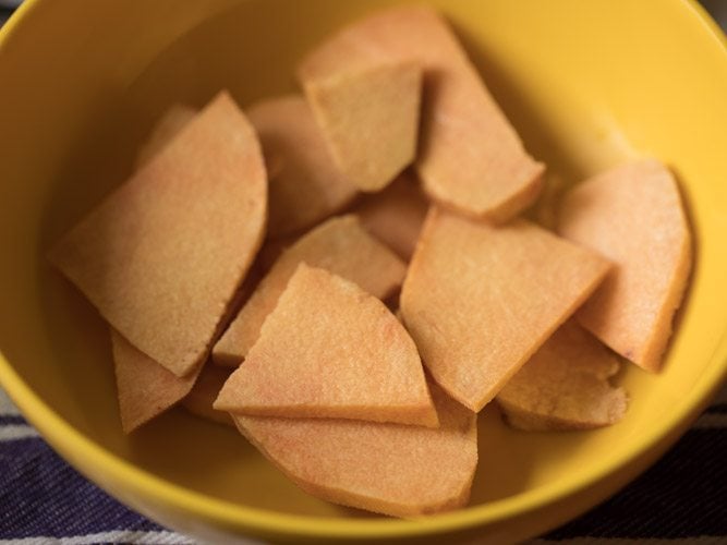 yam slices in a yellow bowl