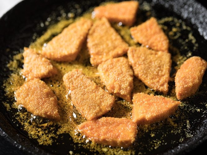 yam sliced being fried