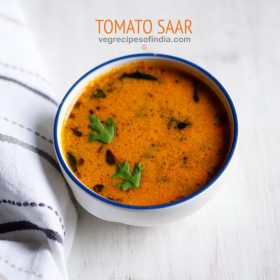 tomato saar served in a blue rimmed white ceramic bowl with text layovers.