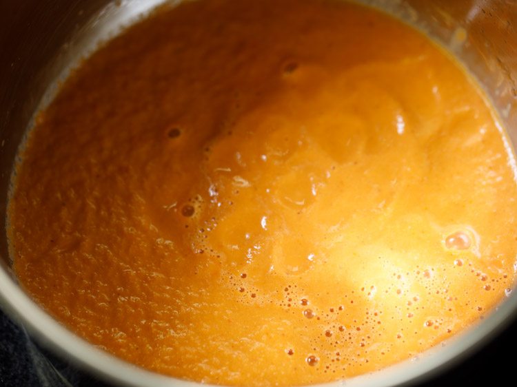 prepared tomato-coconut paste added in a pan. 