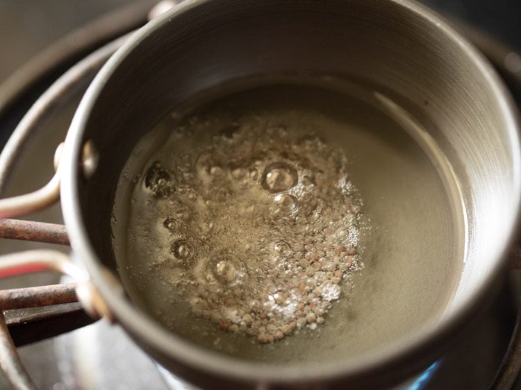 mustard seeds crackling in hot oil. 