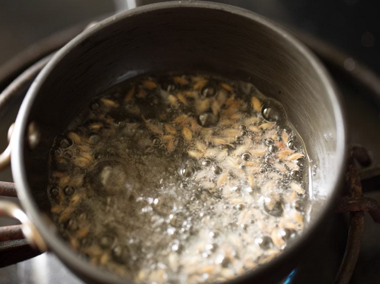 cumin seeds crackling in the hot oil. 