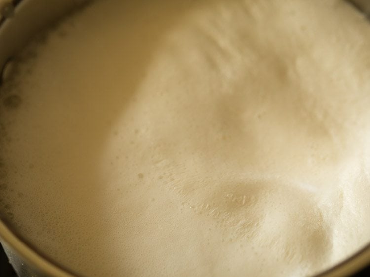 heating milk till it comes to a boil.