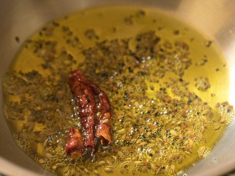 frying the spices till aromatic. 