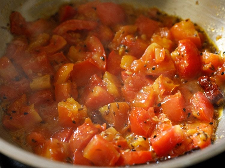 cooking tomato mixture till soft and mushy. 