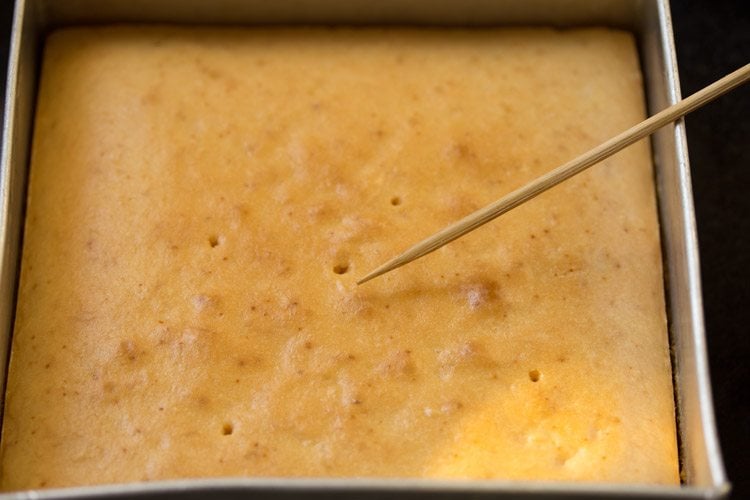 toothpick coming out clean from the baked sponge cake